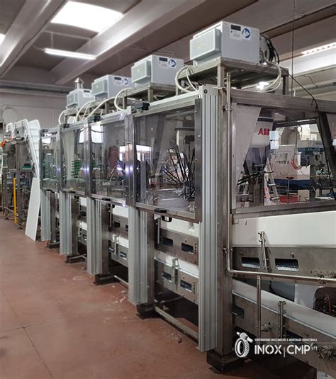 Esempio di essiccatore e pulitrice per il polline. Automatic packaging line of frosty food in boxes composed ...