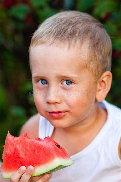 Baby Boy Eats A Piece Of Ripe Red Watermelon Happy Childhood In The