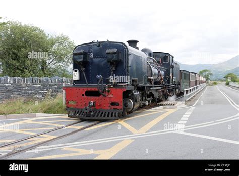 A Steam Locomotive With A Passenger Train On The Welsh Highland Line