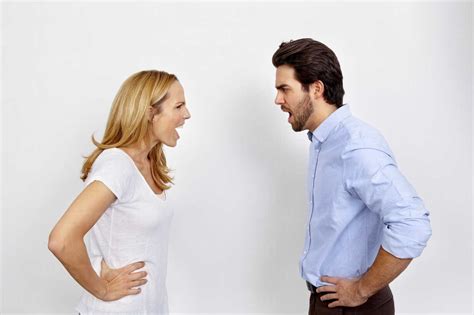Angry Couple Shouting At Each Other In Front Of White Background Stock
