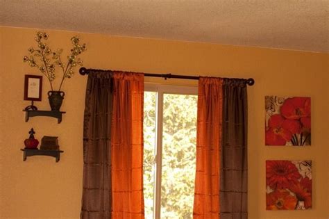 Especially not in a bathroom. Image result for burnt orange and brown living room curtains | Orange curtains living room ...