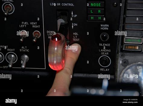 A Pilot Does A Preflight Check Of The Landing Gear Switch Stock Photo