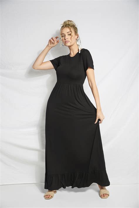 woman wearing a black tall maxi dress with a tiered hem and short sleeves tall maxi dress tall