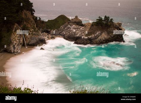 Long Exposure Shot Of The Lovely Mcway Falls And Beach In Big Sur