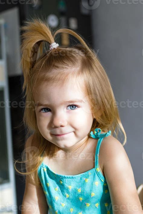Adorable Baby Girl With Blond Hair And Blue Eyes In The Morning In