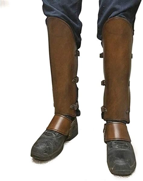 The Legs And Feet Of A Person Wearing Brown Leather Gaiters With Straps