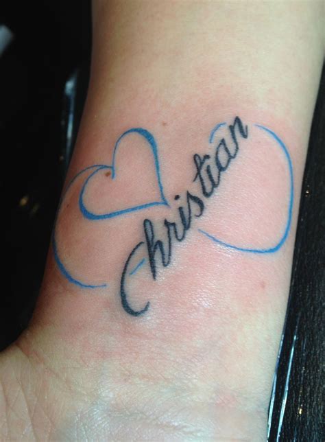 Cute Blue Heart With Infinity Symbol And Name Tattoo On