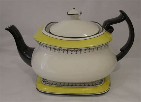 A Striking And Unusual Carlton Ware Teapot And Stand In White Black