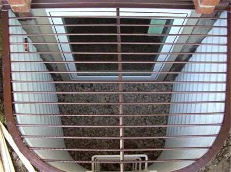 There are basement window wells on the driveway, covered with grates. Boman Kemp Window Well Grate Cover | Window well cover ...