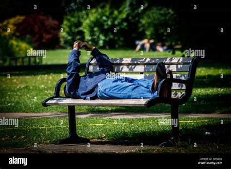 Man Sleeping On A Bench Stock Photo Alamy