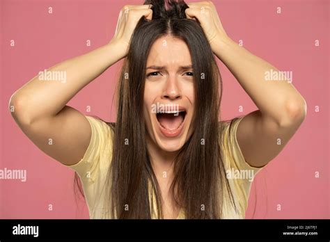 Closeup Portrait Stressed Frustrated Woman Screaming Isolated On Pink