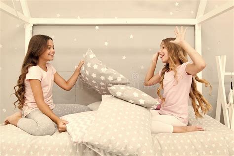 soulmates girls having fun sleepover party girls happy friends with cute pillows pillow fight