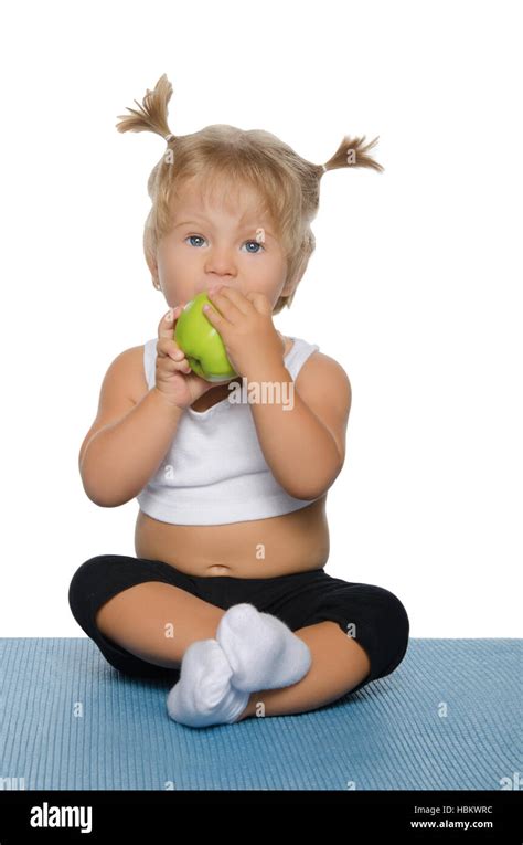 Little Girl With Green Apple Stock Photo Alamy