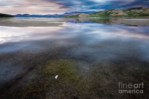 Dramatic Sky Mirrored On Lake Laberge Yukon Canada Photograph By