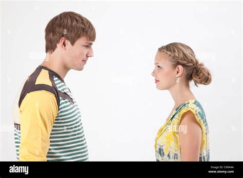 Young Couple Facing Each Other Stock Photo Alamy
