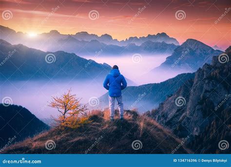 Man On The Mountain Peak Looking On Mountain Valley Stock Photo Image