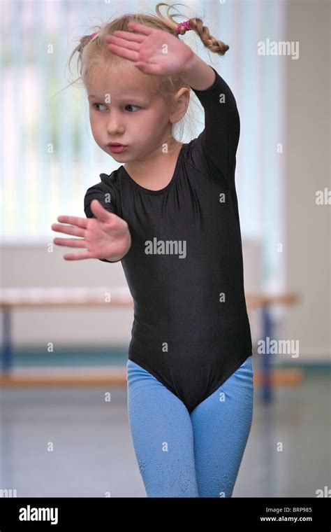 Closeup Of Little Gymnast Girl Doing Exercises Stock Photo Alamy