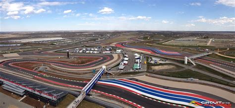 An Aerial View Of A Race Track With Cars On It