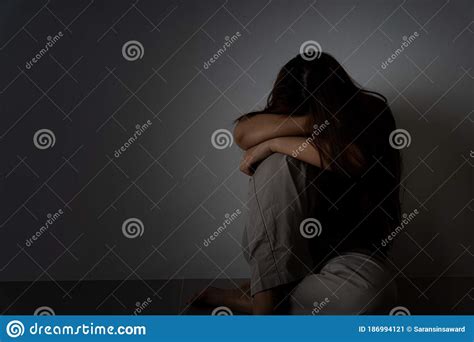 Sad Woman Hug Her Knee And Cry Sitting Alone In A Dark Room Depression Unhappy Stressed And