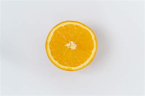 Top View Of One Orange Round Fruit On A White Background Rich Citrus