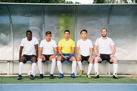 Soccer Players Sitting On The Bench Waiting For The Match To Start By