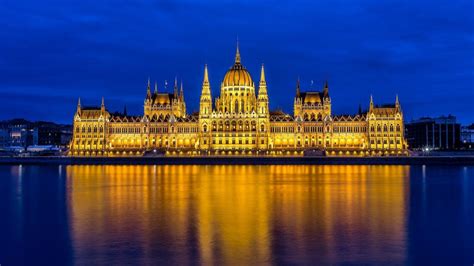 Hungarian Parliament Building At Budapest By Night Backiee