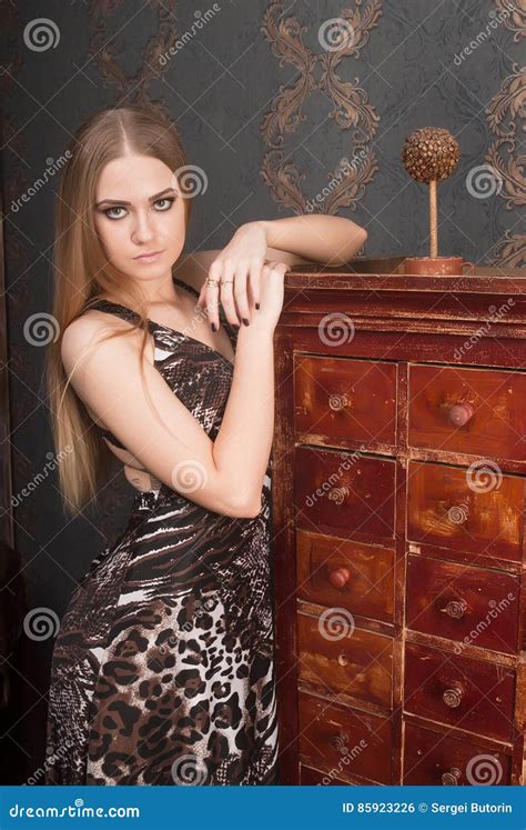 Beautiful Young Blonde Haired Woman Opens Drawer Stock Photo Image Of