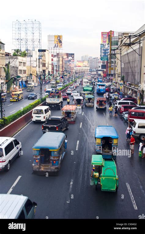 Traffic In Manila With Jeeps Car Taxi And Bicycles Stock Photo Alamy