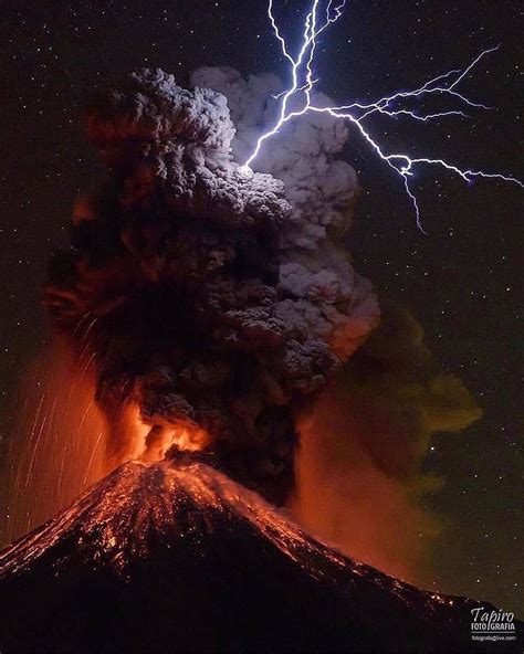 Lighting Strikes Over An Erupting Volcano The Lightning Strike Is