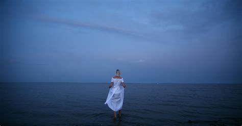 Woman Standing On Shoreline · Free Stock Photo