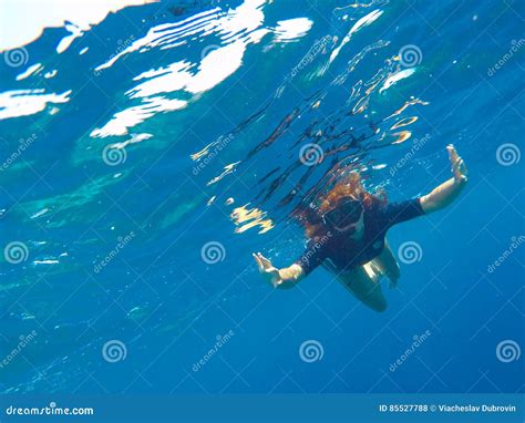 A Woman Underwater In Black Swimsuit And Mask Loose Hair Girl