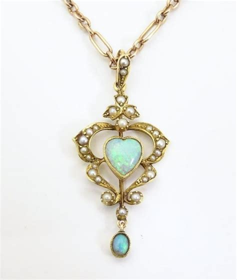 An Art Nouveau 15ct Gold Pendant Set With Opals And Aug 04 2021