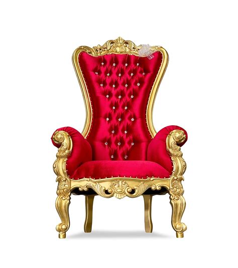 A Red Chair With Gold Trimmings And Buttons On The Back Sitting In