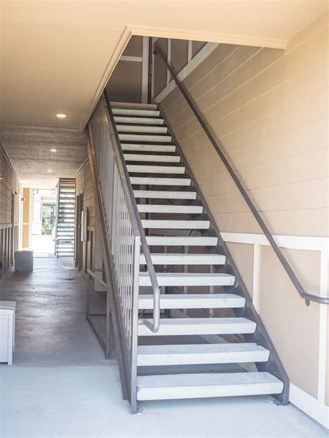 Our aluminum stairs can also be custom fabricated for specific applications and lengths. Metal Exterior Apartment Stairs Installation - Fire Escape Stairs Houston | Aber Fence