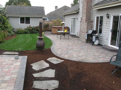 A pickax can help loosen up the soil, which will make it easier to start laying the concrete pavers within the stringed area. Before & After Paver Patio Landscape - Eugene, Springfield ...