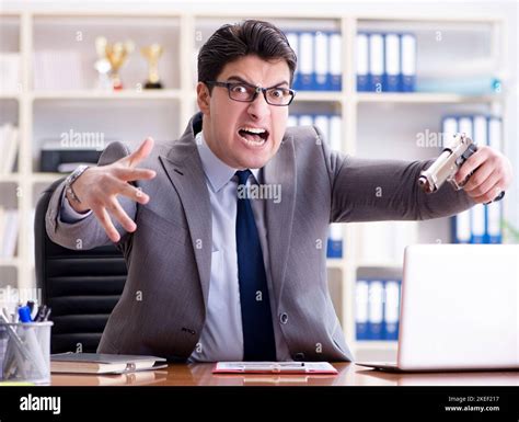 The Angry Aggressive Businessman In The Office Stock Photo Alamy