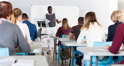 African American Teacher Giving Presentation For Students Stock Image