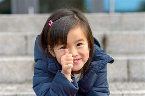 Cute Smiling Little Asian Girl Giving A Thumbs Up Stock Image Image Of Smiling Asian 164611789