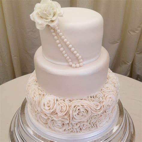 rose ruffle wedding cake with pearlised sheen middle tier finished with large rose and edible