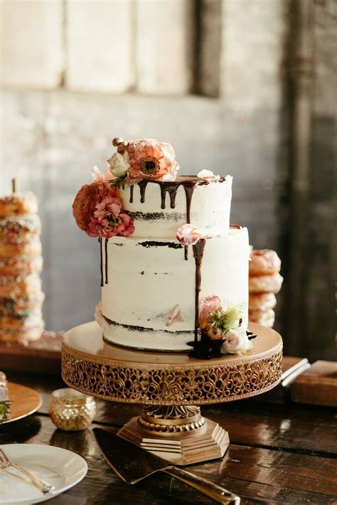 Semi Naked Wedding Cake With Chocolate Drip On Golden Cake Stand