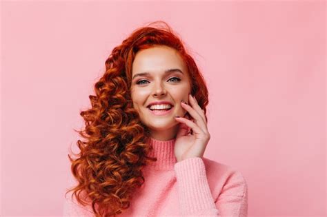 Premium Photo Charming Blue Eyed Red Haired Woman Laughs Touches Her