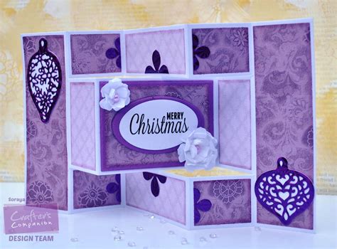 The apertures allow the peonies to be seen through the design. Creative Crafters: Tri Fold Shutter Card for Christmas