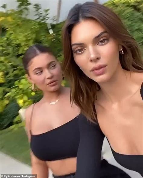 Kendall And Kylie Jenner Show Off Their Assets In Plunging Tops