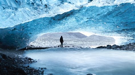 Download Wallpaper 2560x1440 Cave Ice Man Glacier Frozen Widescreen