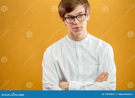 Close Up Portrait Of Pensive Young Good Looking Man In White Shirt