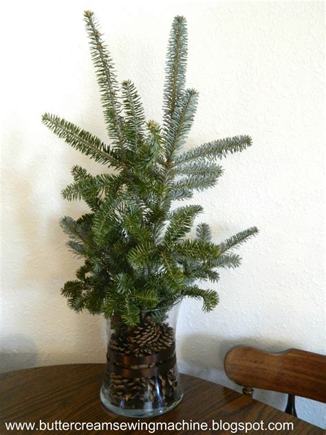 Yet many of us simply don't have the time or space to put a christmas tree up in our homes… or do we? Buttercream and a Sewing Machine: Christmas Branch Decor