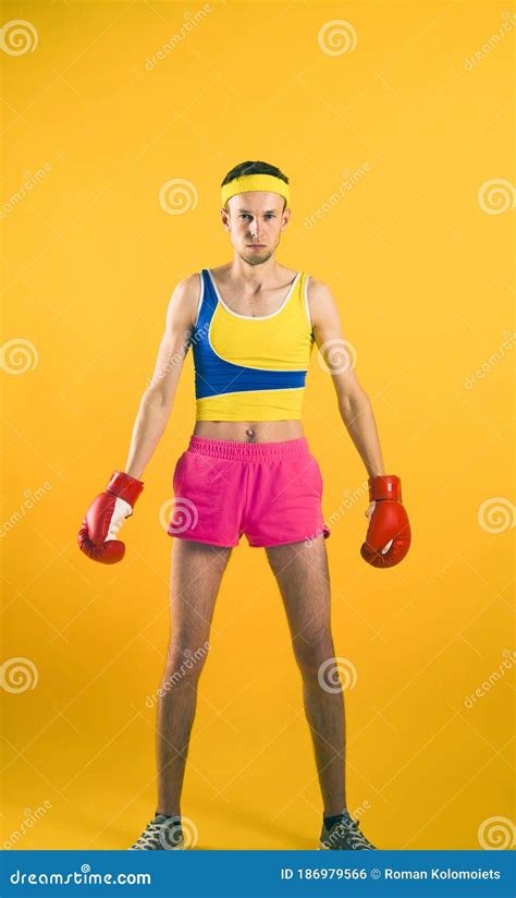Weak Man Flexing His Muscles Stock Photography