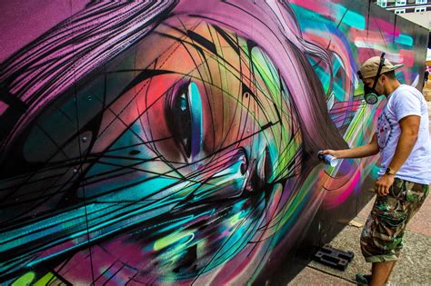 Graffiti art and style writing around the world. Street artist Hopare at work on one of his colorful ...