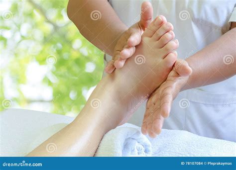 thai foot massage alternative medicine therapy with thai herb aroma oil background for spa or
