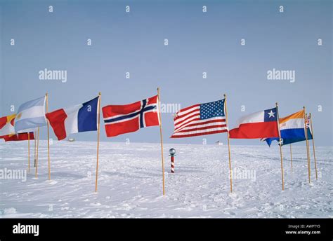 The Flags Of The Antarctic Treaty Nations Around The Ceremonial South